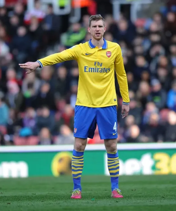 Framed Print : Per Mertesacker in Action: Stoke City vs Arsenal, Premier League 2013-14