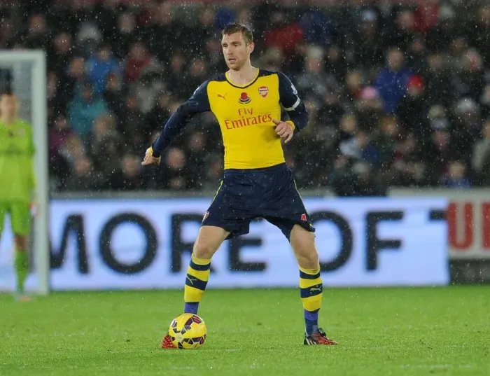 Framed Print : Per Mertesacker in Action: Swansea vs Arsenal, Premier League 2014-15