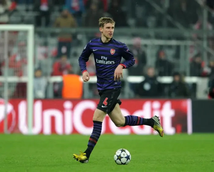 Framed Print : Per Mertesacker (Arsenal). Bayern Munich 0: 2 Arsenal. UEFA Champions League. Round of 16
