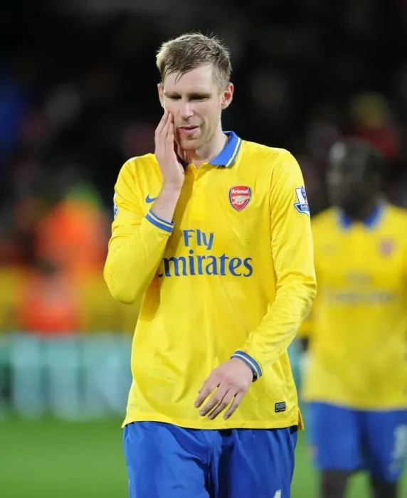 Framed Print : Per Mertesacker (Arsenal). Cardiff City 0: 3 Arsenal. Barclays Premier League. Cardiff City Stadium