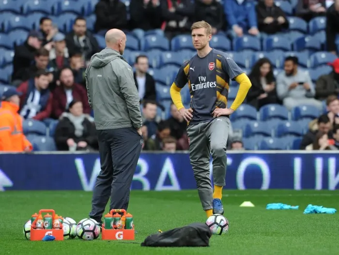 Framed Print : Per Mertesacker (Arsenal) chats to Steve Bould (Arsenal Assistant Manager)