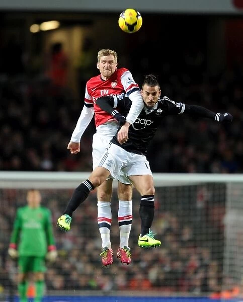 Per Mertesacker (Arsenal) Dani Osvaldo (Southampton). Arsenal 2: 0 Southampton. Barclays