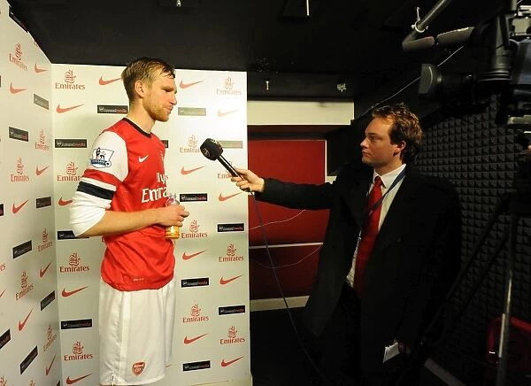 Per Mertesacker (Arsenal) is interviewed after the match by Josh James for Arsenal TV