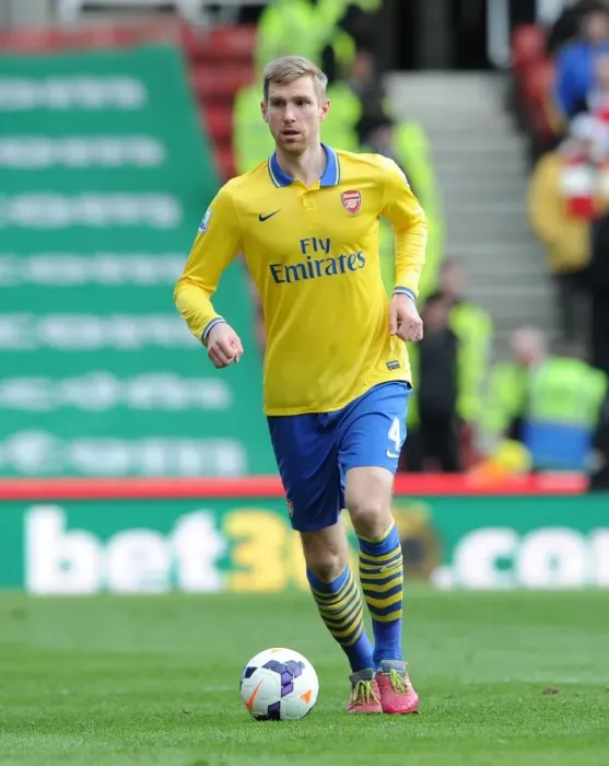 Framed Print : Per Mertesacker (Arsenal). Stoke City 1: 0 Arsenal. Barclays Premier League. The Britainna Stadium
