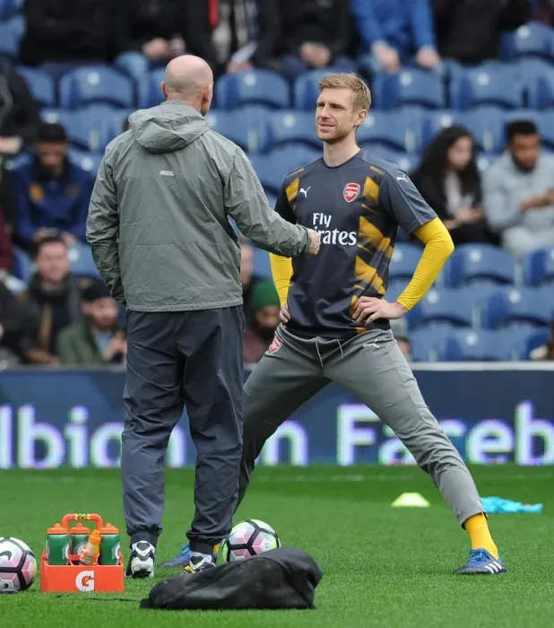 Framed Print : Mertesacker and Bould in Deep Discussion: Arsenal's Defensive Strategy Amidst West Brom's 3:1 Victory