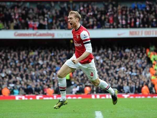 Per Mertesacker celebrates scoring Arsenals 1st goal. Arsenal 5: 2 Tottenham Hotspur