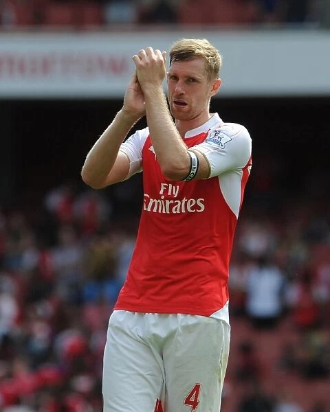 Per Mertesacker: Deep in Thought After Arsenal's Battle Against West Ham United (2015-16)