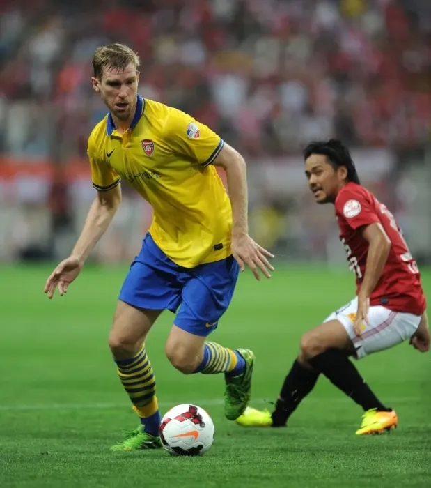 Framed Print : Per Mertesacker Faces Off Against Shinzo Koroki in Arsenal's 2013 Pre-Season Clash with Urawa Red Diamonds Framed Print : Per Mertesacker Faces Off Against Shinzo Koroki in Arsenal's 2013 Pre-Season Clash with Urawa Red Diamonds