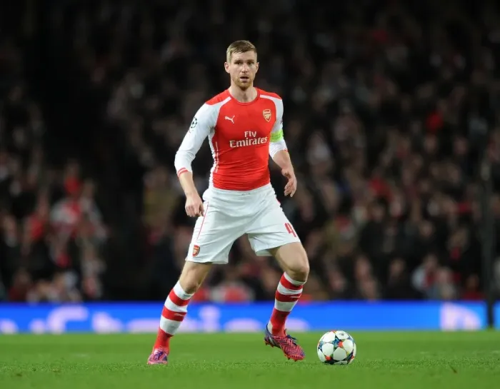 Framed Print : Per Mertesacker Focuses in Arsenal's UEFA Champions League Clash Against AS Monaco