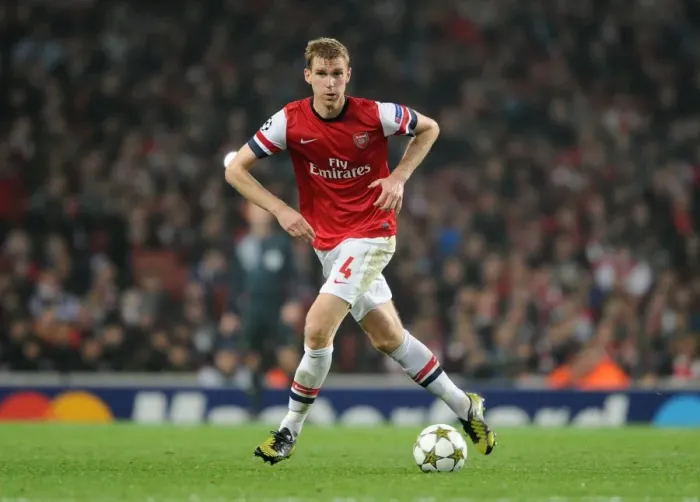 Framed Print : Per Mertesacker Focuses in Arsenal's UEFA Champions League Clash Against Schalke 04 (2012-13) Framed Print : Per Mertesacker Focuses in Arsenal's UEFA Champions League Clash Against Schalke 04 (2012-13)