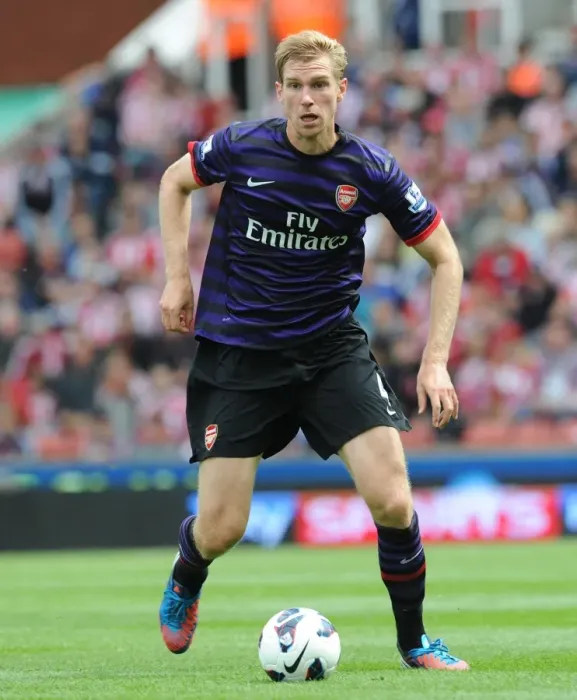 Framed Print : Per Mertesacker Focuses in Stoke City vs Arsenal Premier League Clash (2012-13)