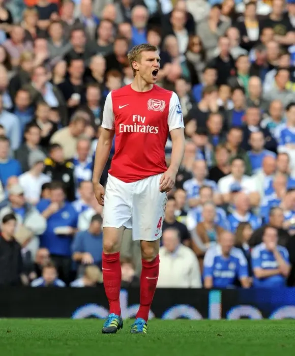 Framed Print : Per Mertesacker Leads Arsenal to a 5-3 Victory over Chelsea in the Premier League (2011-12)