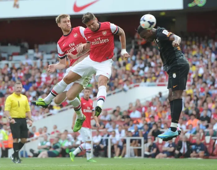 Framed Print : Per Mertesacker and Olivier Giroud (Arsenal) Didier Drogba (Galatasaray). Arsenal 1: 2 Galatasaray
