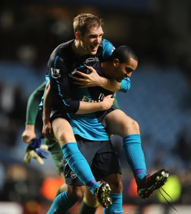 Framed Print : Per Mertesacker and Theo Walcott's Celebration: Arsenal Secure Victory over Aston Villa (2011-12) Framed Print : Per Mertesacker and Theo Walcott's Celebration: Arsenal Secure Victory over Aston Villa (2011-12)