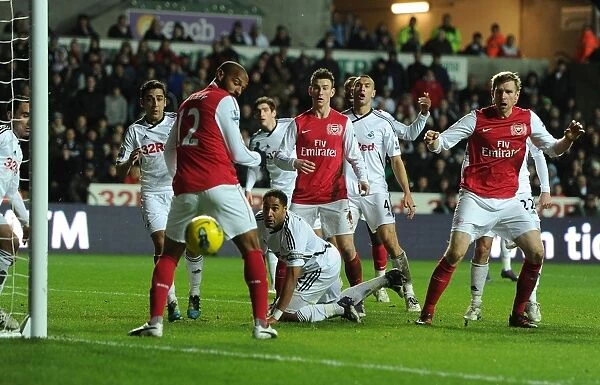 Per Mertesacker and Thierry Henry: A Moment from Swansea City vs. Arsenal, Premier League, 2012