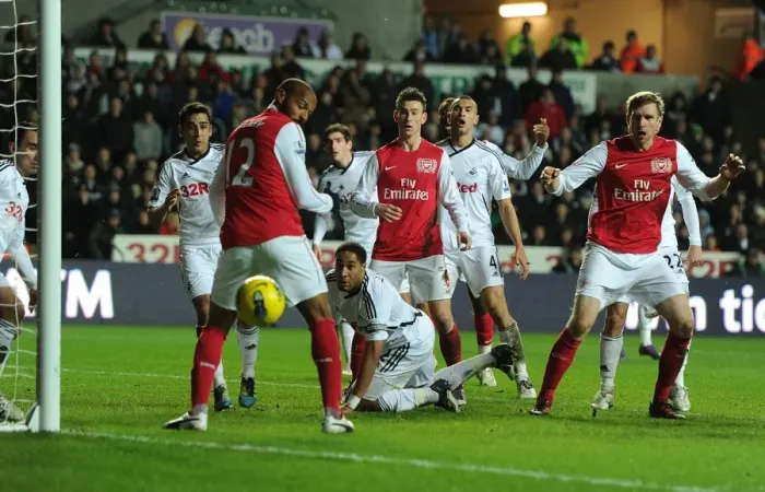 Framed Print : Per Mertesacker and Thierry Henry: A Moment from Swansea City vs. Arsenal, Premier League, 2012 Framed Print : Per Mertesacker and Thierry Henry: A Moment from Swansea City vs. Arsenal, Premier League, 2012