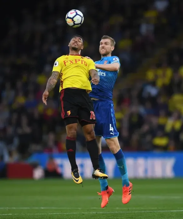 Framed Print : Per Mertesacker vs. Andre Gray: Heading Clash in Arsenal's Victory over Watford (2017-18) Framed Print : Per Mertesacker vs. Andre Gray: Heading Clash in Arsenal's Victory over Watford (2017-18)