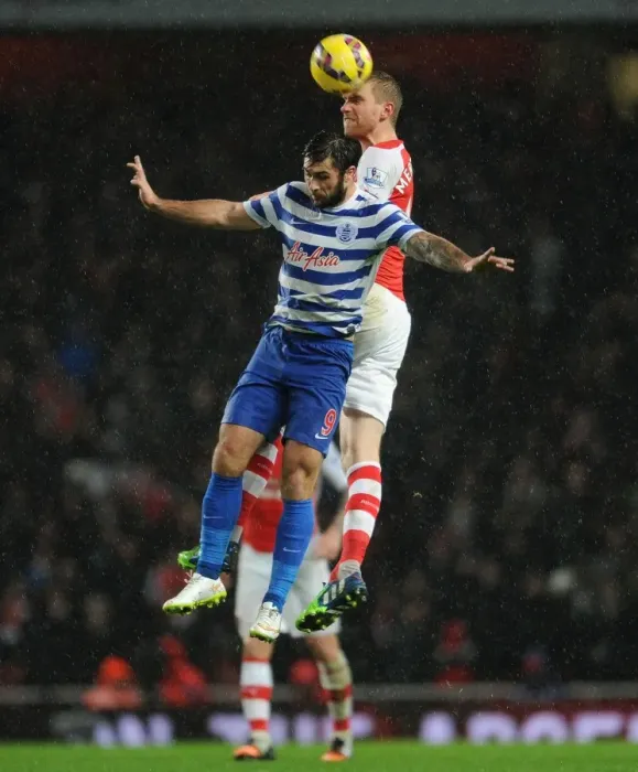 Framed Print : Per Mertesacker vs. Charlie Austin: Heading for Victory - Arsenal vs. Queens Park Rangers, Premier League, 2014 Framed Print : Per Mertesacker vs. Charlie Austin: Heading for Victory - Arsenal vs. Queens Park Rangers, Premier League, 2014