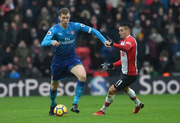 Framed Print : Per Mertesacker vs. Dusan Tadic: A Football Rivalry in the Southampton vs. Arsenal Premier League Clash (December 2017) Framed Print : Per Mertesacker vs. Dusan Tadic: A Football Rivalry in the Southampton vs. Arsenal Premier League Clash (December 2017)