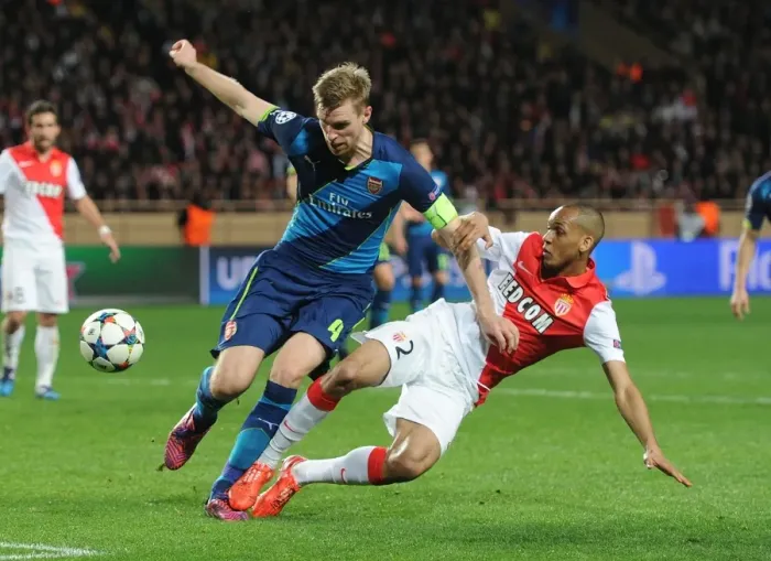Framed Print : Mertesacker vs Fabinho: Intense Clash in Monaco's UCL Showdown against Arsenal Framed Print : Mertesacker vs Fabinho: Intense Clash in Monaco's UCL Showdown against Arsenal