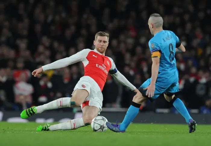 Framed Print : Mertesacker vs. Iniesta: A Battle of Champions - Arsenal vs. Barcelona, 2015 / 16 Framed Print : Mertesacker vs. Iniesta: A Battle of Champions - Arsenal vs. Barcelona, 2015 / 16