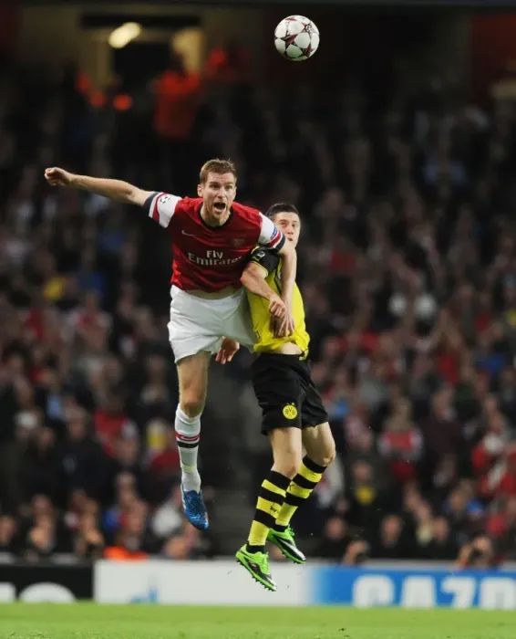 Framed Print : Mertesacker vs Lewandowski: A Battle at the Emirates - Arsenal vs Borussia Dortmund, UEFA Champions League Framed Print : Mertesacker vs Lewandowski: A Battle at the Emirates - Arsenal vs Borussia Dortmund, UEFA Champions League