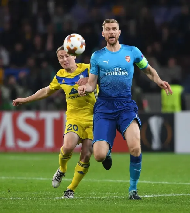 Framed Print : Per Mertesacker vs. Vitali Rodionov: A Battle in the UEFA Europa League between Arsenal FC and BATE Borisov