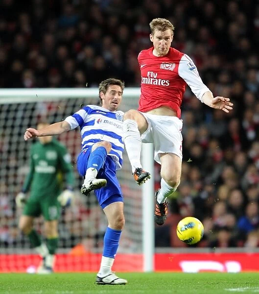 Per Mertesacker Wins the Ball from Tommy Smith in Arsenal vs. Queens Park Rangers (2011-12)