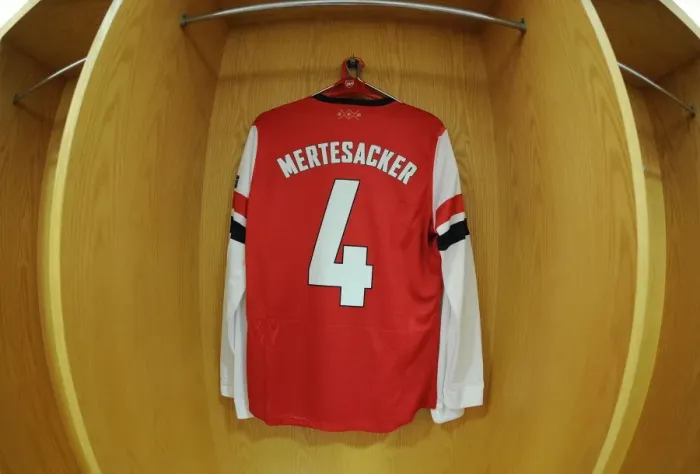Framed Print : Per Mertesacker's Arsenal Jersey in the Changing Room Before Arsenal vs. Bayern Munich, UEFA Champions League 2014 Framed Print : Per Mertesacker's Arsenal Jersey in the Changing Room Before Arsenal vs. Bayern Munich, UEFA Champions League 2014