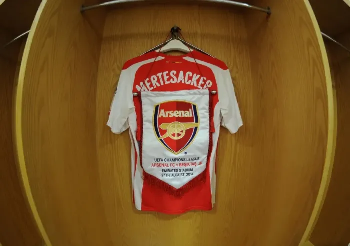 Framed Print : Per Mertesacker's Arsenal Shirt in Arsenal Changing Room Before UCL Match against Besiktas (2014)