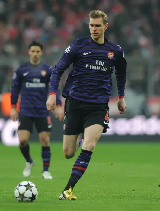 Framed Print : Per Mertesacker's Defiant Display: Arsenal's Valiant Stand at Allianz Arena, UEFA Champions League 2012-13 Framed Print : Per Mertesacker's Defiant Display: Arsenal's Valiant Stand at Allianz Arena, UEFA Champions League 2012-13