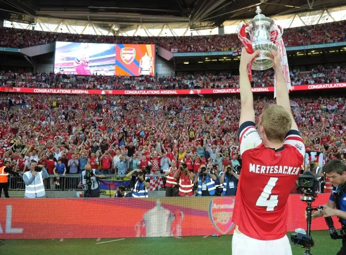 Framed Print : Per Mertesacker's Triumph: Arsenal's FA Cup Victory at Wembley