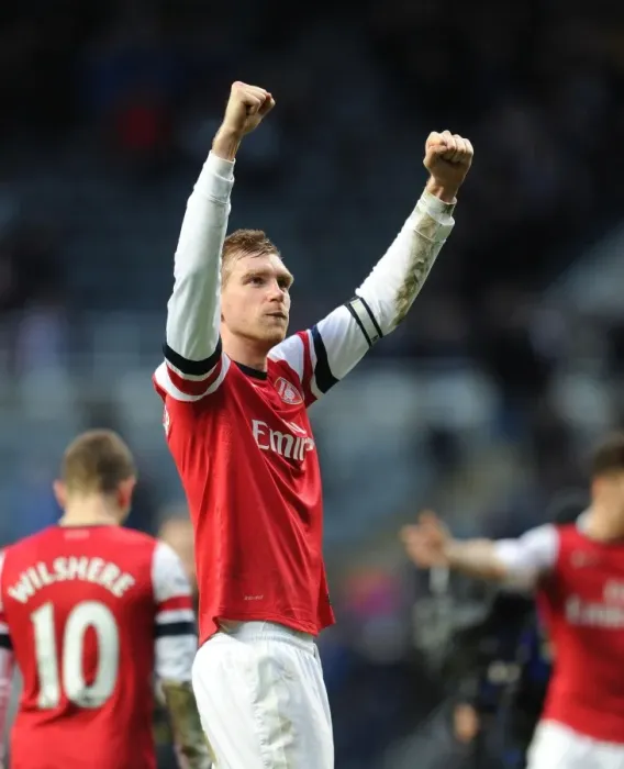 Framed Print : Per Mertesacker's Triumph: Arsenal's Victory over Newcastle United, Premier League 2013-14 - The Unforgettable Moment of Per Mertesacker's Celebration at St. James Park