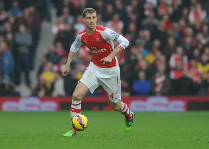 Framed Print : Per Mertesacker's Unwavering Concentration: Arsenal vs. West Bromwich Albion (November 2014)