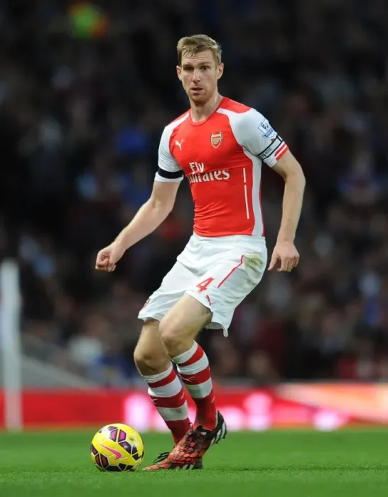 Framed Print : Per Mertesacker's Unwavering Concentration: Arsenal's Victory Against Burnley (2014 / 15)
