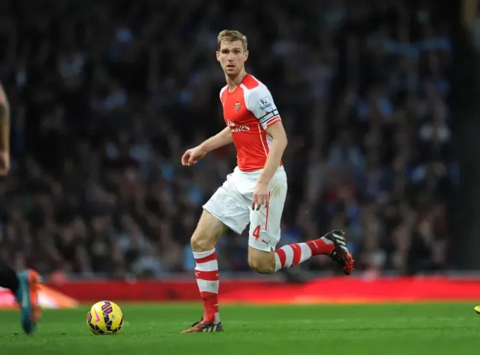 Framed Print : Per Mertesacker's Unwavering Focus: Arsenal's Triumph Over Burnley (2014 / 15)
