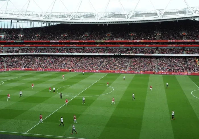 Framed Print : A message to China supporting them after the recent earthquake on the ad Boards. Arsenal 1