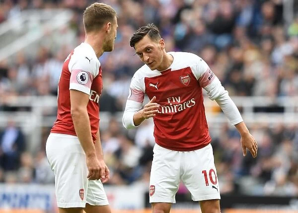 Mesut Ozil and Aaron Ramsey in Deep Conversation: Newcastle United vs. Arsenal FC, 2018-19 Premier League