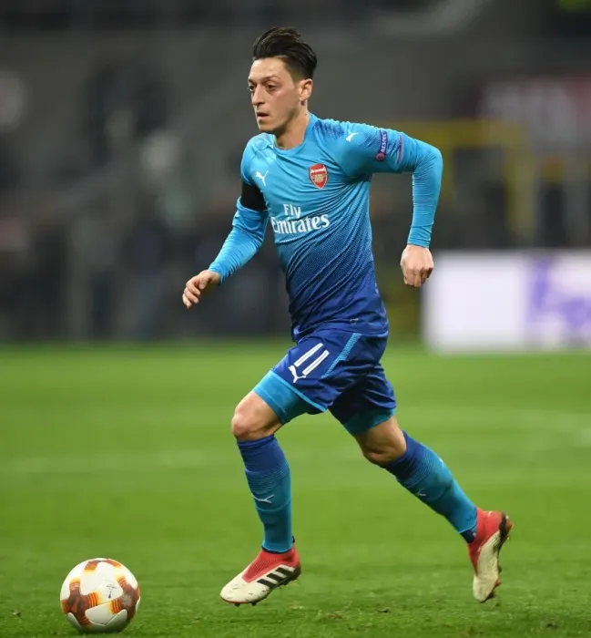 Framed Print : Mesut Ozil in Action: Arsenal vs. AC Milan, UEFA Europa League Round of 16 (First Leg)