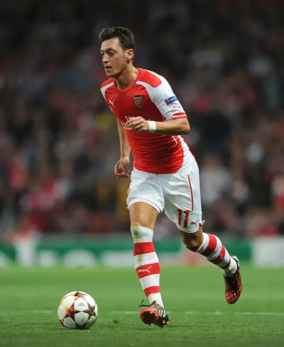Framed Print : Mesut Ozil in Action: Arsenal vs Besiktas, UEFA Champions League (2014)