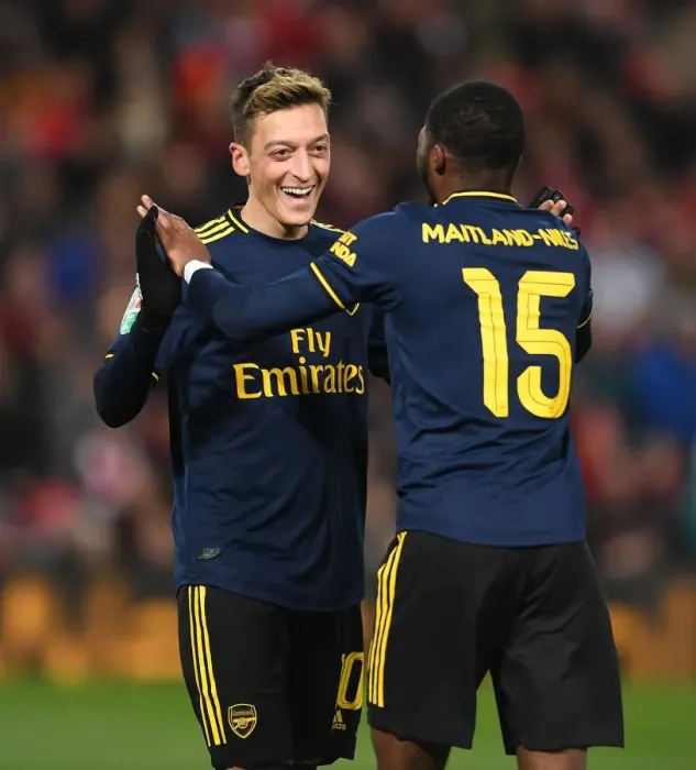Framed Print : Mesut Ozil and Ainsley Maitland-Niles Celebrate Arsenal's Four Goals Against Liverpool in Carabao Cup