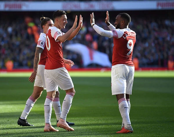 Mesut Ozil and Alexandre Lacazette Celebrate Goals: Arsenal's Winning Moment Against Watford (2018-19)