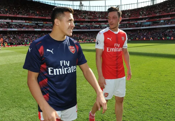 Framed Print : Mesut Ozil and Alexis Sanchez: A Moment of Connection at Arsenal's Emirates Stadium (Arsenal v Everton 2016-17)