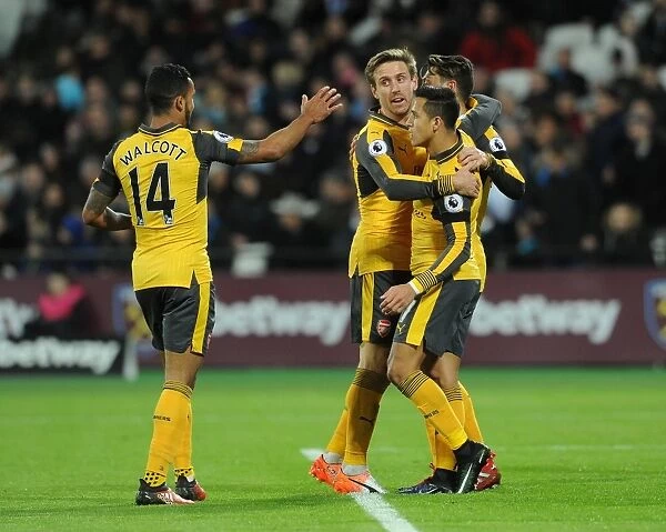 Mesut Ozil, Alexis Sanchez, Theo Walcott, and Nacho Monreal Celebrate Arsenal's First Goal Against West Ham United