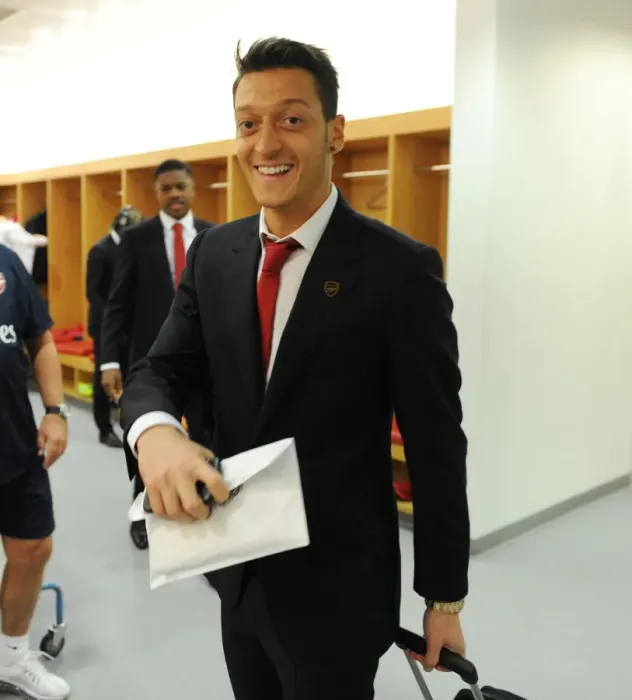 Framed Print : Mesut Ozil Arrives at Arsenal Changing Room Before Arsenal vs Liverpool (2013-14)