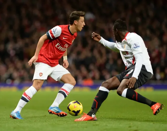 Framed Print : Mesut Ozil (Arsenal) Aly Cissokho (Liverpool). Arsenal 2: 0 Arsenal. Barclays Premier League Framed Print : Mesut Ozil (Arsenal) Aly Cissokho (Liverpool). Arsenal 2: 0 Arsenal. Barclays Premier League