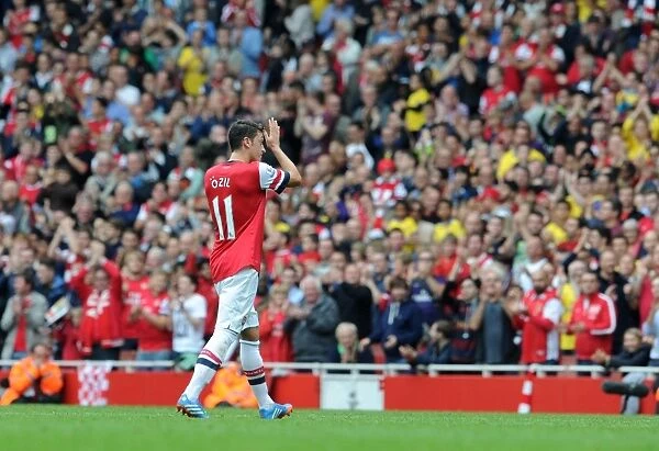 Mesut Ozil (Arsenal) claps the fans as he leaves the pitch. Arsenal 3:1 Stoke City