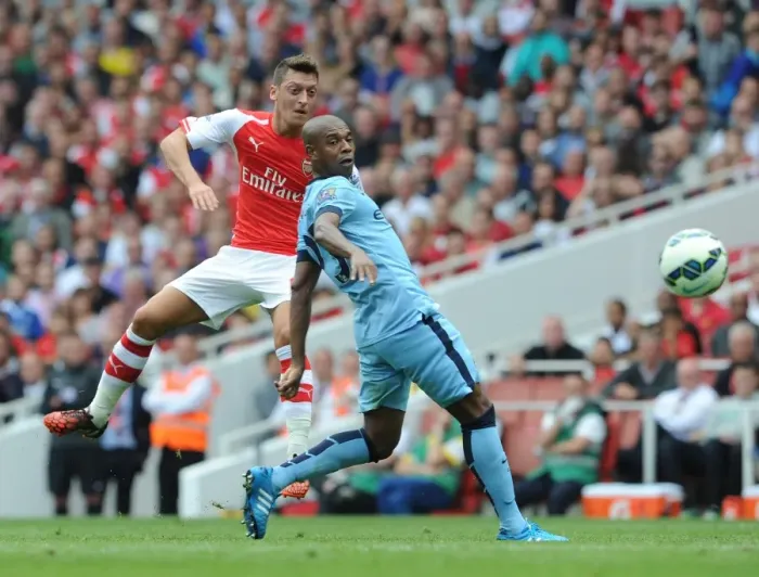 Framed Print : Mesut Ozil (Arsenal) Fernadinho (Man City). Arsenal 2: 2 Manchester City. Barclays Premier League Framed Print : Mesut Ozil (Arsenal) Fernadinho (Man City). Arsenal 2: 2 Manchester City. Barclays Premier League