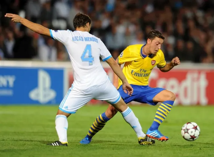 Framed Print : Mesut Ozil (Arsenal) Lucas Mendes (Marseille). Olympic Marseille 1: 2 Arsenal. UEFA Champions League