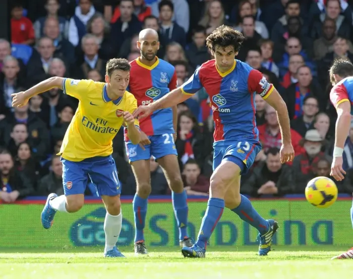 Framed Print : Mesut Ozil (Arsenal) Mile Jedinak (Palace). Crystal Palace 0: 2 Arsenal. Barclays Premier League